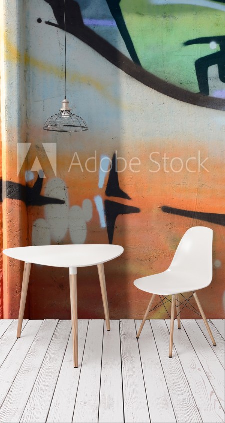 Image de Fragment of graffiti drawings The old wall decorated with paint stains in the style of street art culture Colored background texture in warm tones